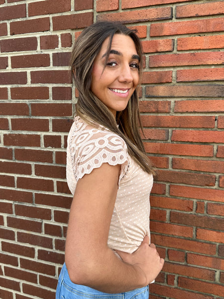 tan polka dot top with lace sleeve detail